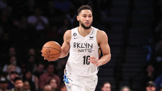 Ben Simmons goes to dribble the ball